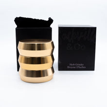 Load image into Gallery viewer, Welcoming Sackvilles, Bougie Grinder, 3-Tier Gilded Grinder enables you to grind more, faster and semmlessly. Perfect for entertaining. The wide plate, diamond-sharp teeth, three tiers and deep-set bowl can handle any herb (rose, lavender, sage, chamomile) so you can get crafty with custom blends. Be multi-functional, but make it fashion.