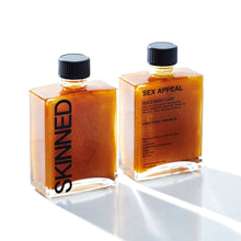 Load image into Gallery viewer, A gold body oil meant to make you feel like an amped up version of yourself. While your skin drinks up the base of the oils, the rest are slowly absorbed, adding a protection lawyer against environmental stressors, leaving you nourished and glowing all day. Our blend of sustainably and ethically sourced, organic ingredients is filled with vitamins and minerals that will invigorate dull-looking skin and reduce the appearance of fine lines and wrinkles.